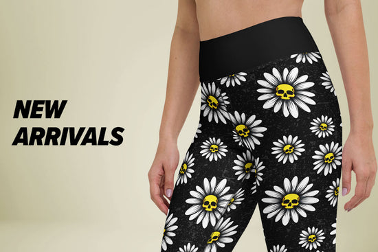 Shop New Arrivals: Model wearing black leggings with white floral patterns on a beige background